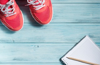 sneakers and a notebook on the floor